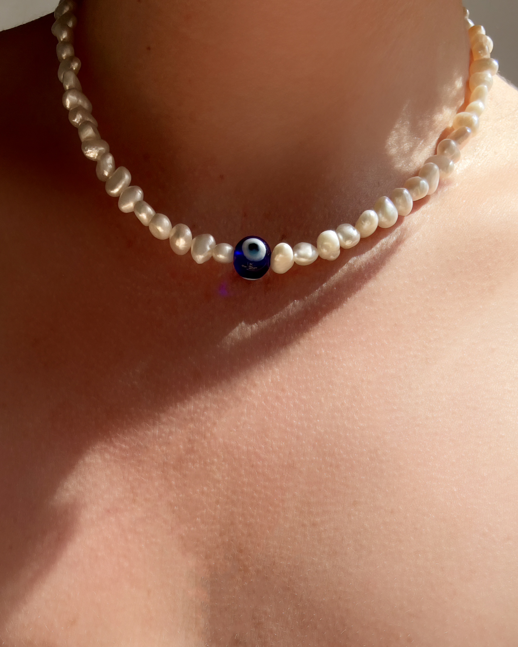COLLIER EYE